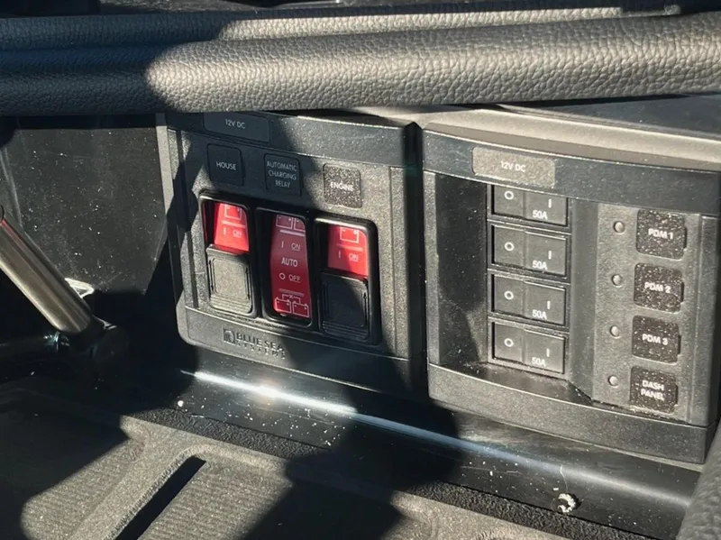 Slide: The Image of Control panel of a 2025 Centurion Ri 265 boat with switches and buttons. - 36