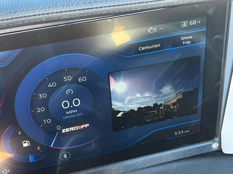 Slide: The Image of 2025 Centurion Ri 265 dashboard display showing speedometer and rearview camera. - 44