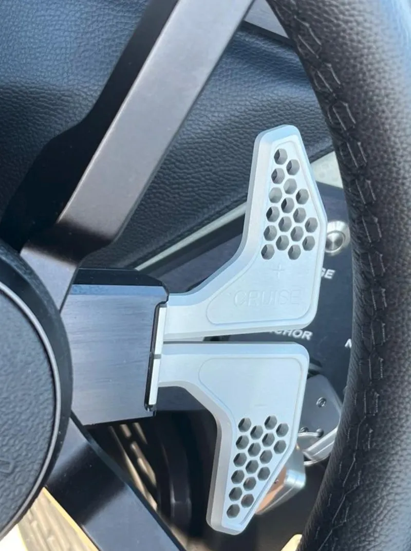 Slide: The Image of Steering wheel of 2025 Centurion Ri 265 with paddle shifters. - 47
