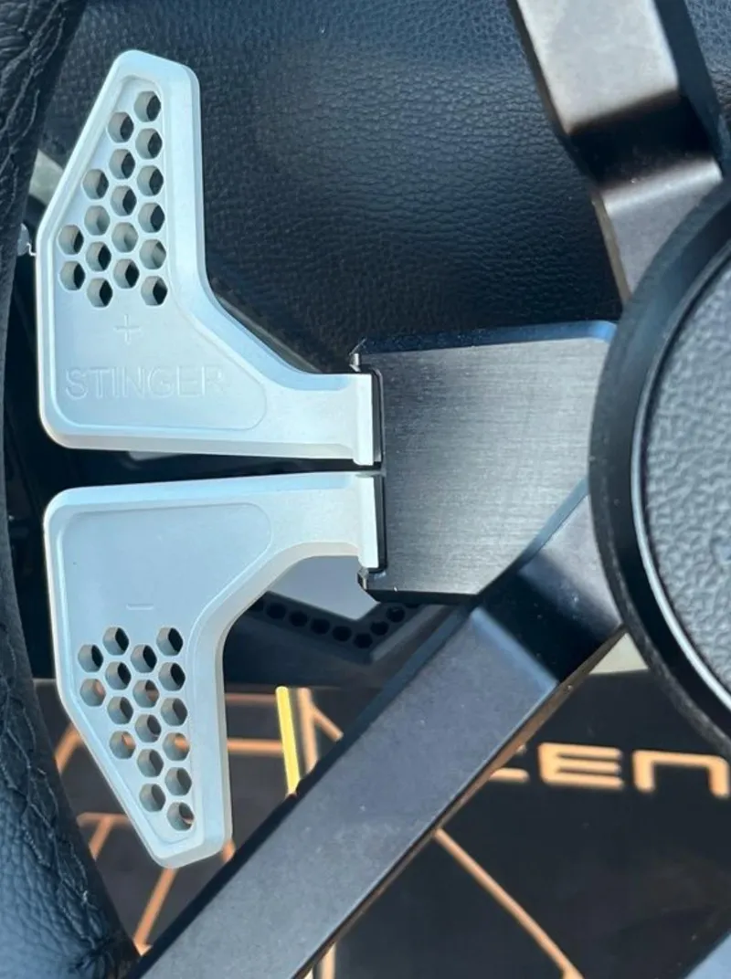Slide: The Image of Steering wheel detail of 2025 Centurion Ri 265 with paddle shifters. - 48