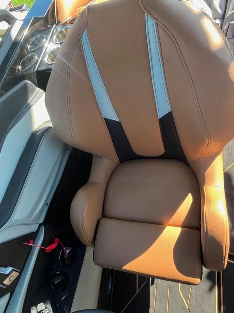 Slide: The Image of 2025 Centurion Ri 265 boat seat, brown leather with gray accents, luxury interior design. - 49