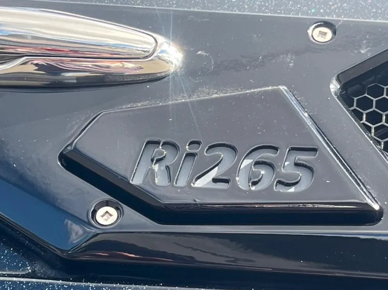 Slide: The Image of Close-up of Centurion Ri 265 emblem on a 2025 model. - 6