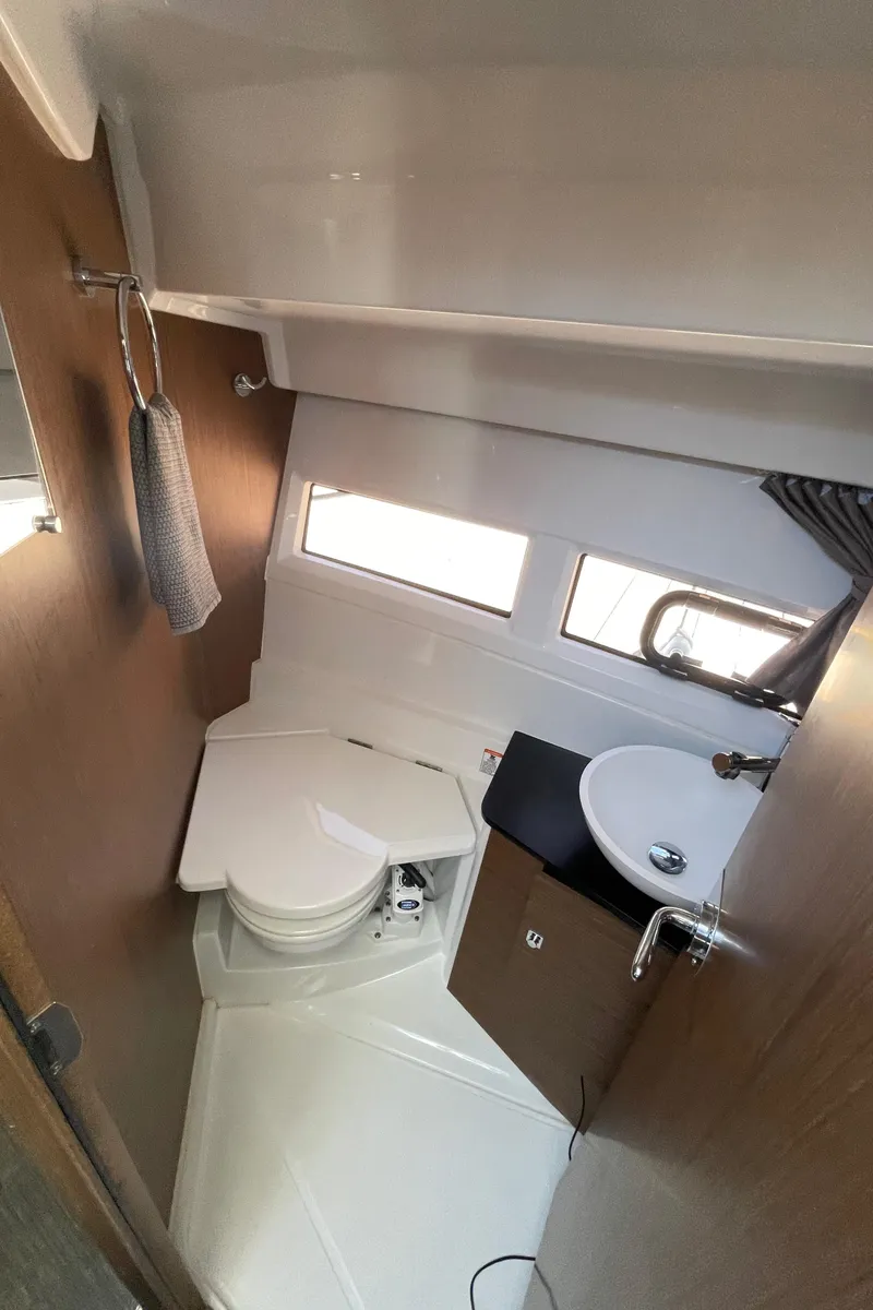 Slide: The Image of 2019 Jeanneau NC895 boat bathroom with compact design and modern fixtures. - 10