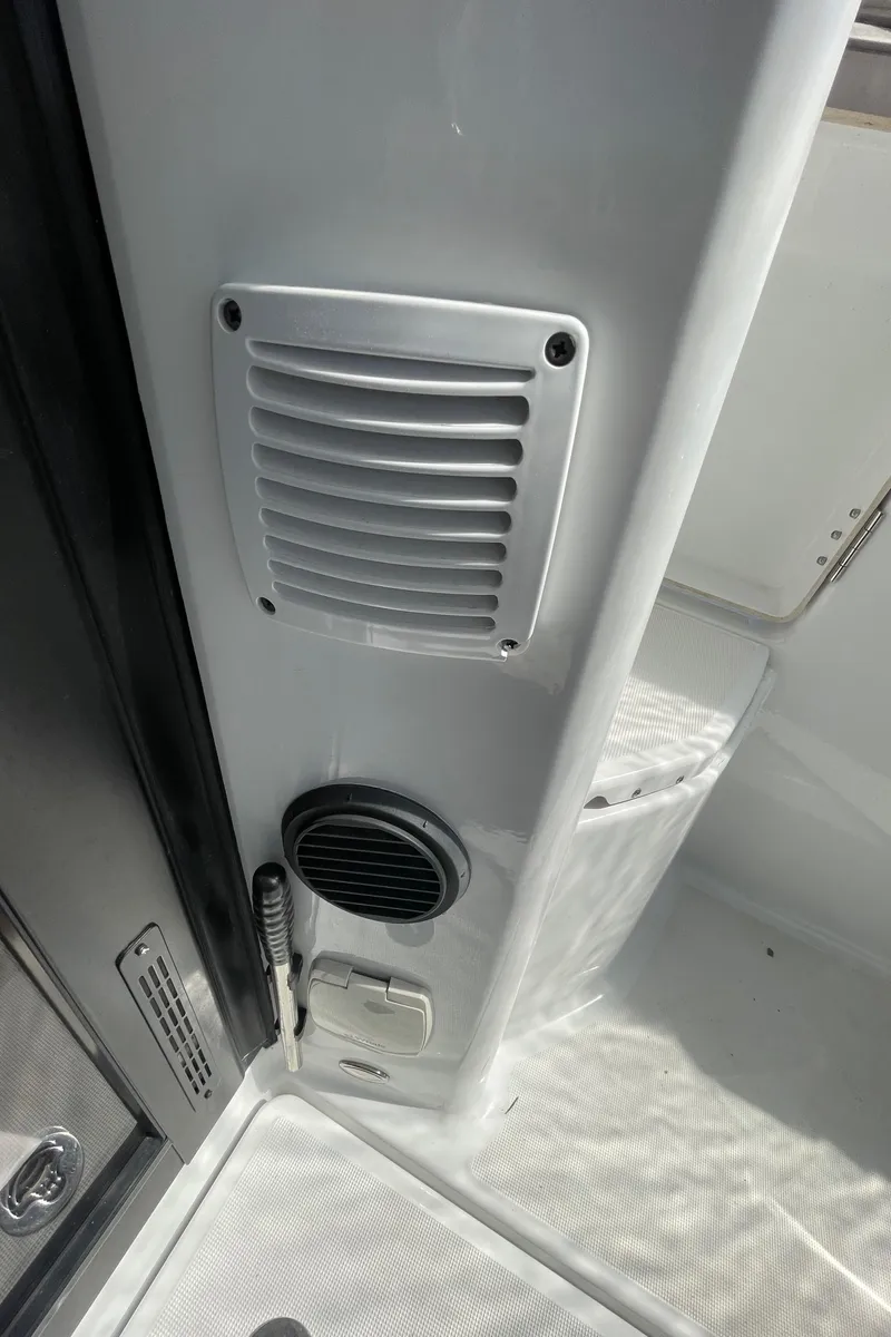 Slide: The Image of Interior view of a 2019 Jeanneau NC895 boat, featuring a speaker and vent. - 13