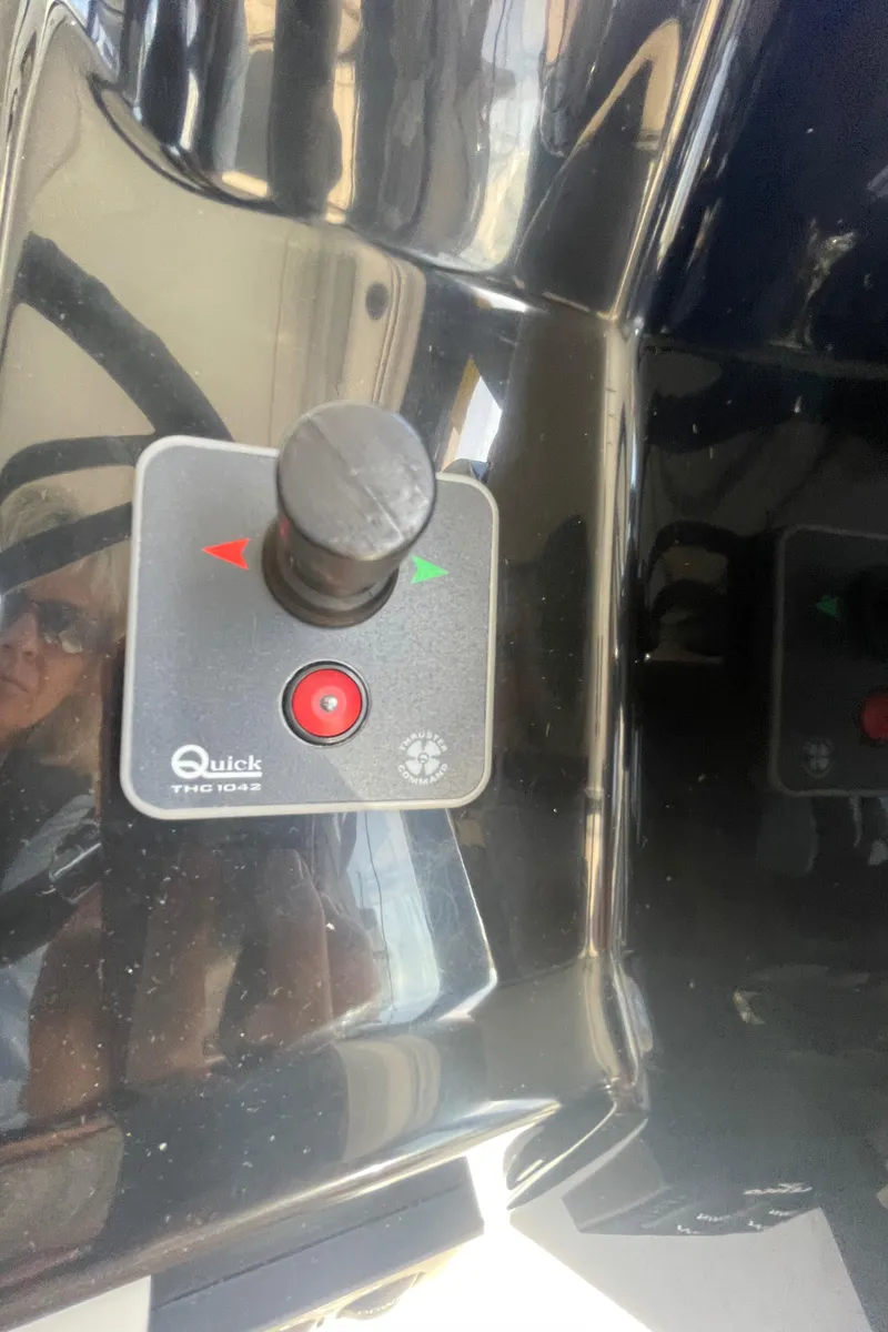 Slide: The Image of Control panel of a 2019 Jeanneau NC895 boat with joystick and buttons. - 22