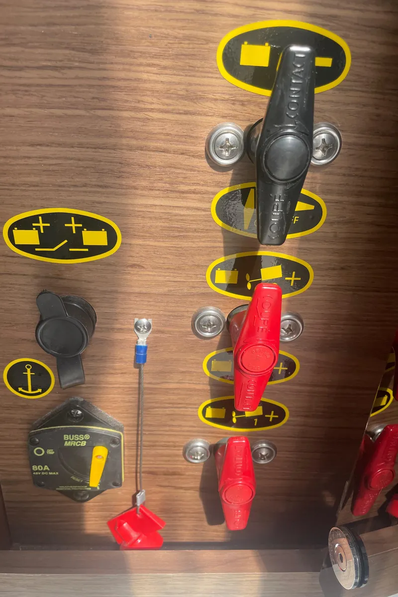 Slide: The Image of Control panel of a 2019 Jeanneau NC895 boat with switches and labels. - 33