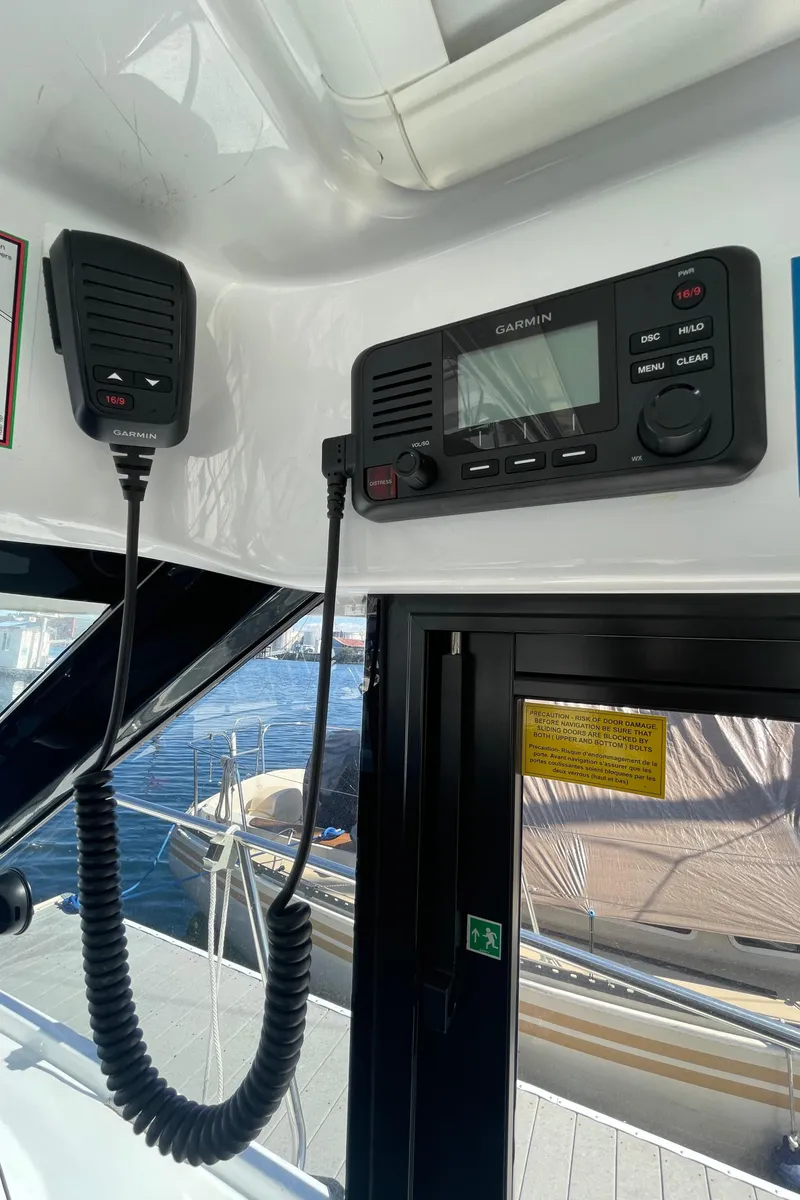 Slide: The Image of 2019 Jeanneau NC895 boat interior with marine radio and microphone. - 34
