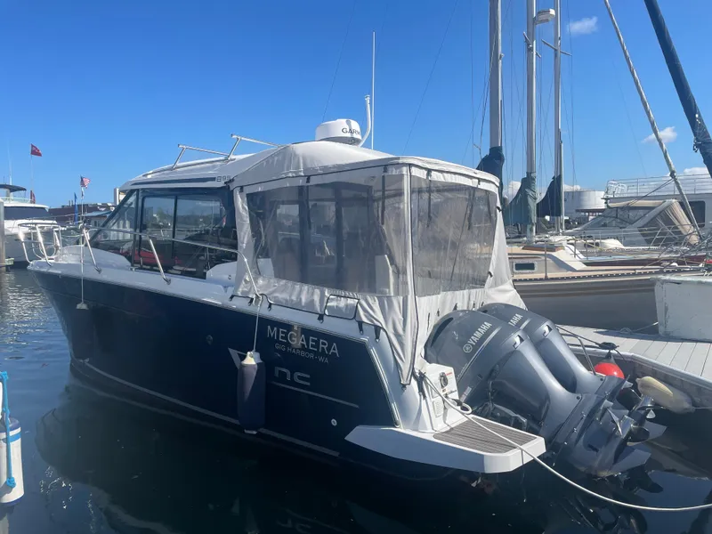 Slide: The Image of 2019 Jeanneau NC895 boat docked with Yamaha outboard engines. - 35
