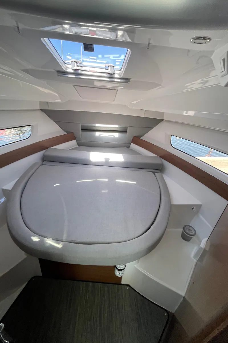 Slide: The Image of 2019 Jeanneau NC895 cabin interior with skylight and cozy bed. - 6