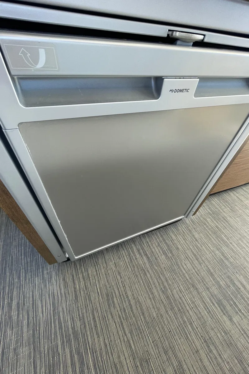 Slide: The Image of 2019 Jeanneau NC895 interior with Dometic fridge, modern design. - 8
