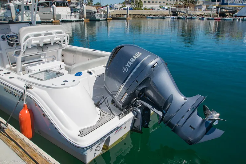Slide: The Image of 2021 Sea Fox 248 Commander boat with Yamaha outboard engine docked in marina. - 1