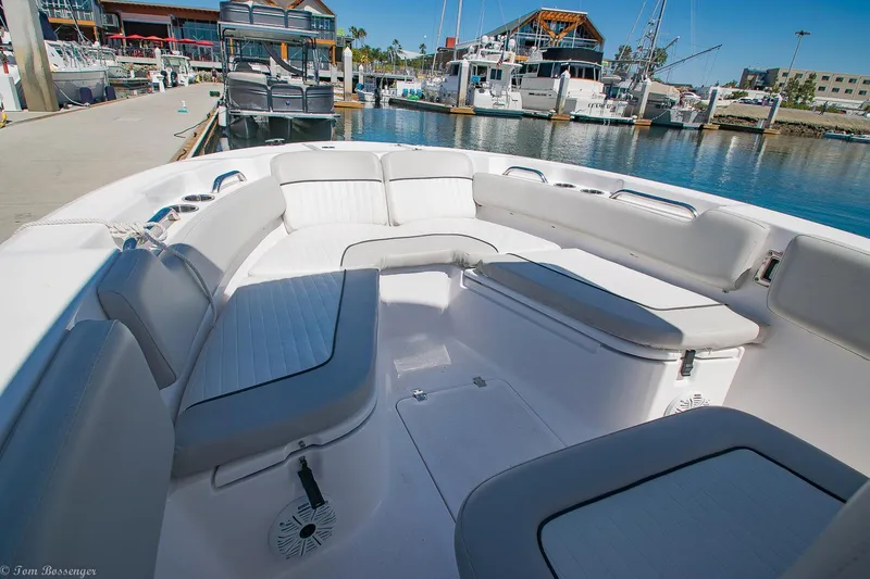 Slide: The Image of 2021 Sea Fox 248 Commander boat interior with spacious seating at a marina. - 13
