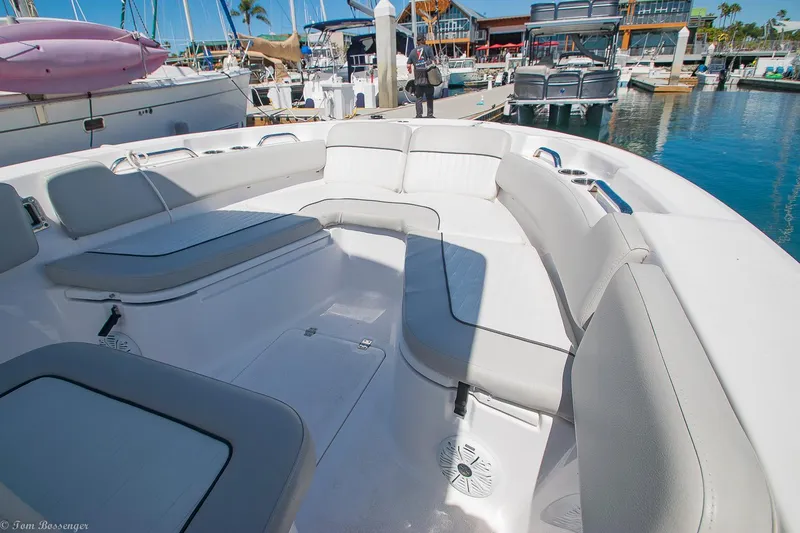 Slide: The Image of 2021 Sea Fox 248 Commander boat interior with spacious seating at a marina. - 14