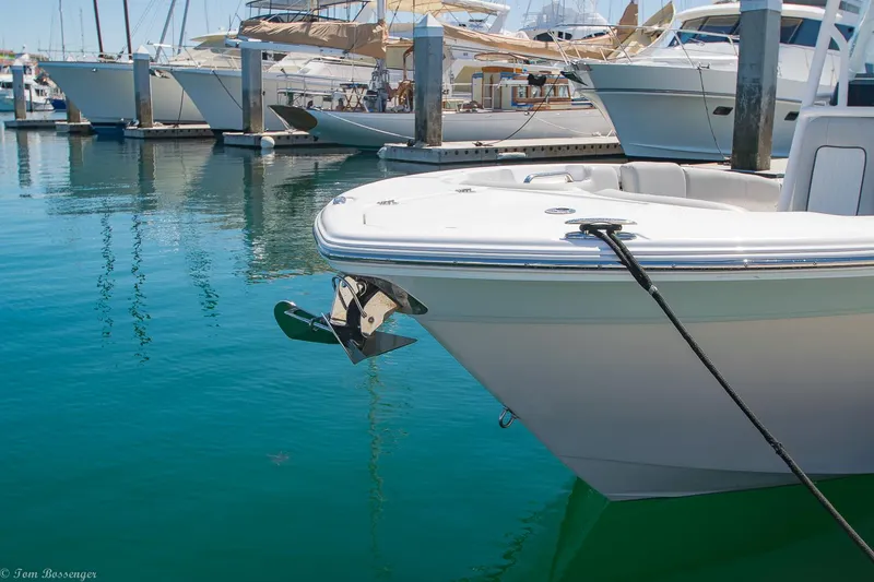 Slide: The Image of 2021 Sea Fox 248 Commander boat docked in a marina with clear blue water. - 25