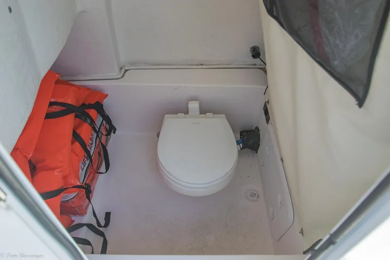 Slide: The Image of 2021 Sea Fox 248 Commander boat interior with toilet and life jackets. - 27
