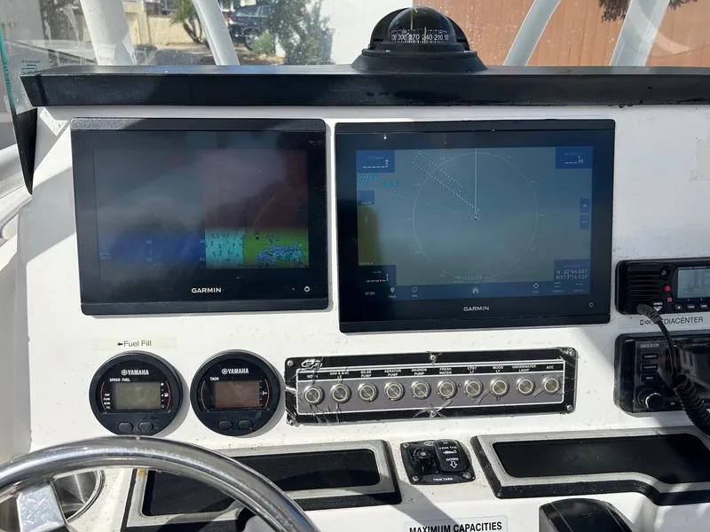 Slide: The Image of Dashboard of 2021 Sea Fox 248 Commander with Garmin displays and controls. - 6
