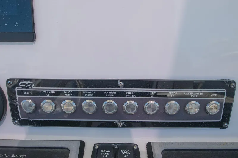 Slide: The Image of Control panel of a 2021 Sea Fox 248 Commander boat with labeled switches. - 9