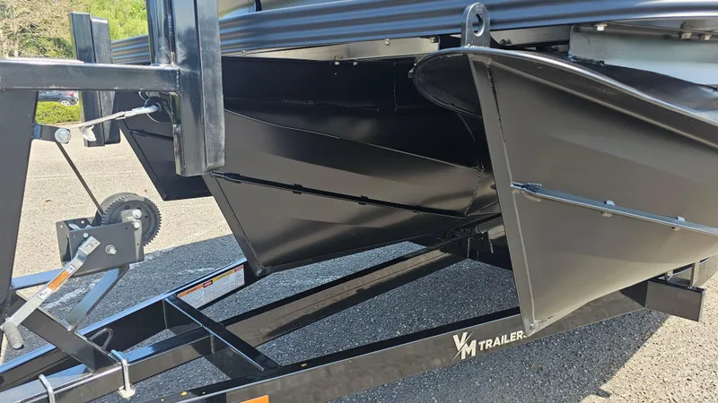 Slide: The Image of 2025 Manitou 24' Explore MAX Deck Navigator on trailer, featuring 150hp Rotax Stealth Motor. - 14