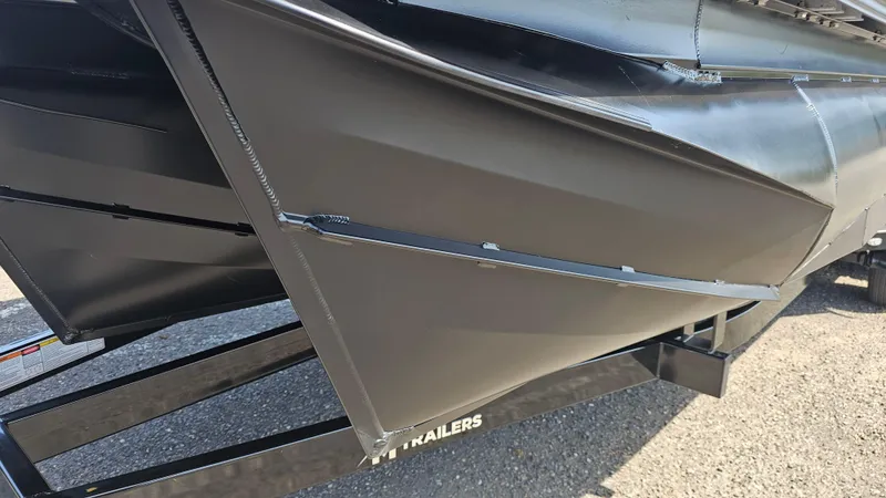 Slide: The Image of 2025 Manitou 24' Explore MAX Deck Navigator with 150hp Rotax Stealth Motor, close-up view. - 24