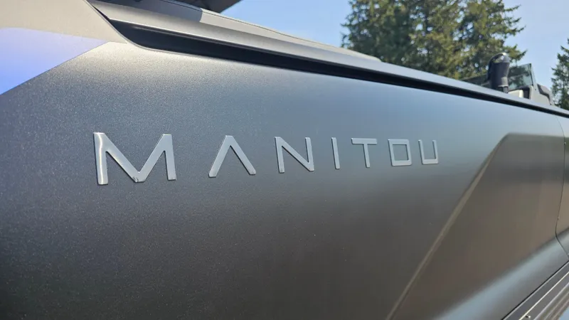 Slide: The Image of 2025 Manitou 24' Explore MAX Deck Navigator with 150hp Rotax Stealth Motor, close-up view. - 28