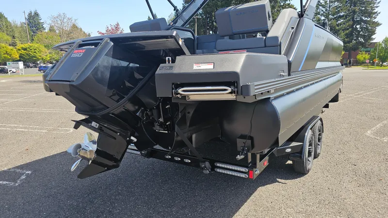 Slide: The Image of 2025 Manitou 24' Explore MAX Deck Navigator with 150hp Rotax Stealth Motor, rear view. - 29