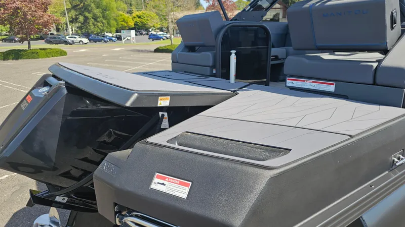 Slide: The Image of 2025 Manitou 24' Explore MAX Deck Navigator with 150hp Rotax Stealth Motor, rear view. - 30