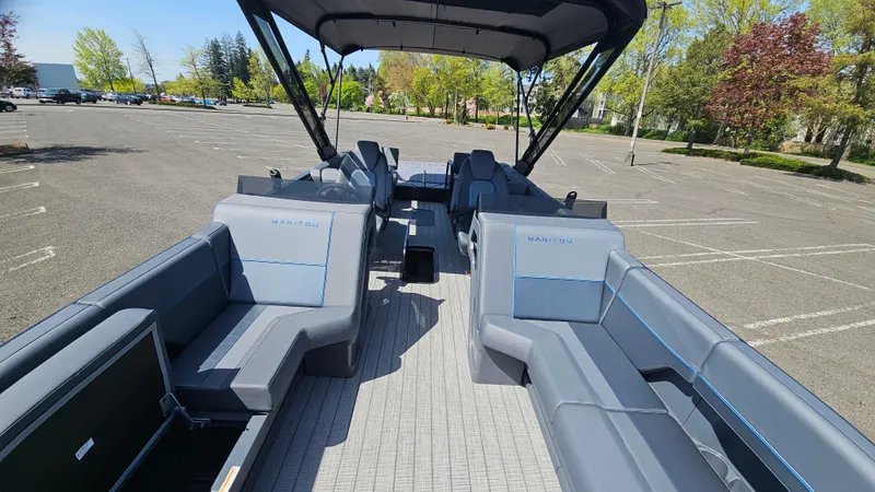 Slide: The Image of 2025 Manitou 24' Explore MAX Deck Navigator with 150hp Rotax Stealth Motor, spacious seating. - 34