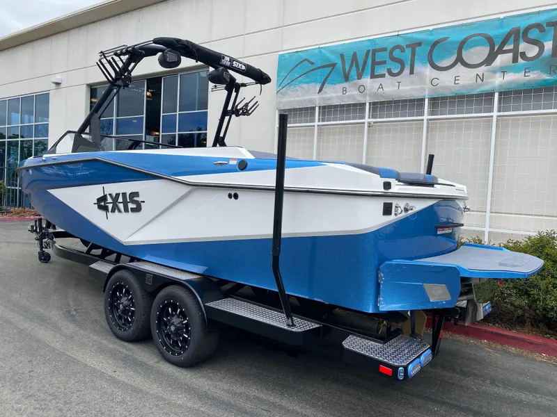 Slide: The Image of 2025 Axis T250 boat in blue and white at West Coast Boat Center. - 16