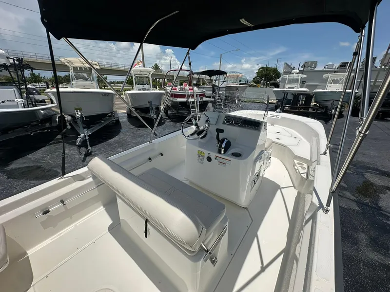 Slide: The Image of 2022 Boston Whaler 170 Montauk boat interior with steering console and seating. - 10