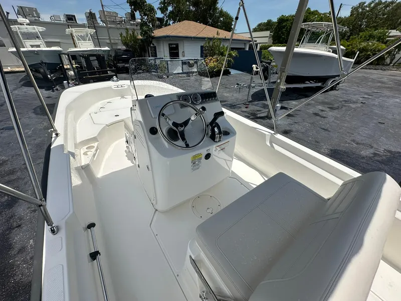 Slide: The Image of 2022 Boston Whaler 170 Montauk boat interior with steering console and seating. - 15