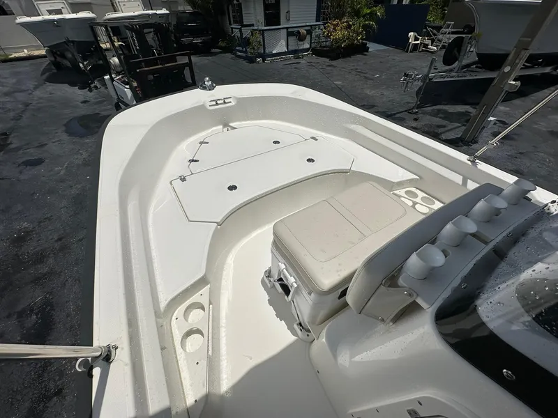 Slide: The Image of 2022 Boston Whaler 170 Montauk boat interior with seating and storage compartments. - 19