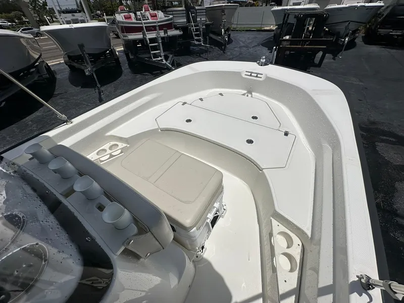 Slide: The Image of 2022 Boston Whaler 170 Montauk boat interior with seating and storage compartments. - 20