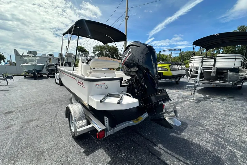 Slide: The Image of 2022 Boston Whaler 170 Montauk boat on trailer, outdoor display, sunny day. - 3