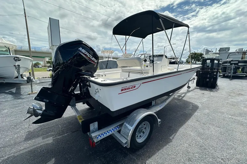 Slide: The Image of 2022 Boston Whaler 170 Montauk boat with Mercury engine on trailer. - 5
