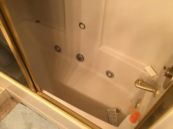 Slide: The Image of Luxurious bathtub with gold fixtures on a 1990 Viking Extended Aft Deck Motor Yacht. - 19