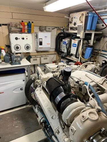 Slide: The Image of Engine room of a 1990 Viking Extended Aft Deck Motor Yacht with visible machinery and equipment. - 20