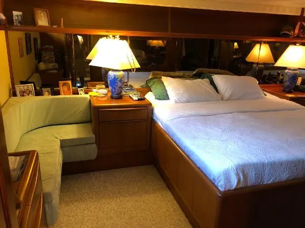 Slide: The Image of Cozy bedroom in 1990 Viking Extended Aft Deck Motor Yacht with elegant decor and soft lighting. - 13