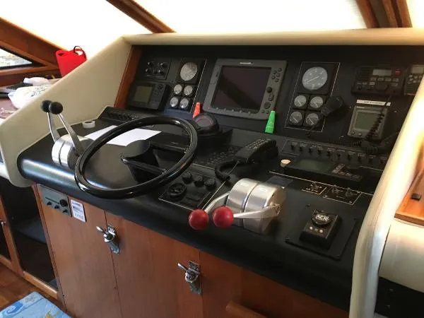 Slide: The Image of Control panel of a 1990 Viking Extended Aft Deck Motor Yacht with navigation instruments. - 17