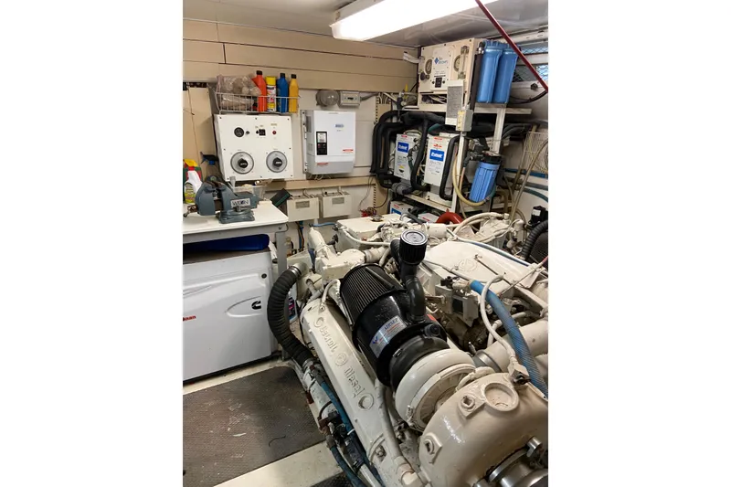 Slide: The Image of Engine room of a 1990 Viking Extended Aft Deck Motor Yacht, showcasing machinery and equipment. - 22
