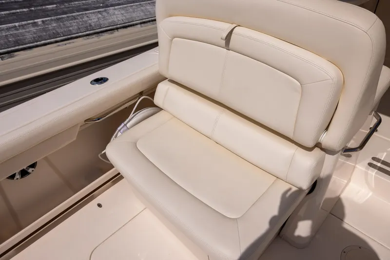 Slide: The Image of 2018 Grady-White Freedom 335 boat seat, beige upholstery, luxurious and comfortable design. - 11
