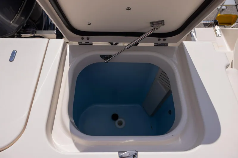 Slide: The Image of Open storage compartment on 2018 Grady-White Freedom 335 boat. - 14