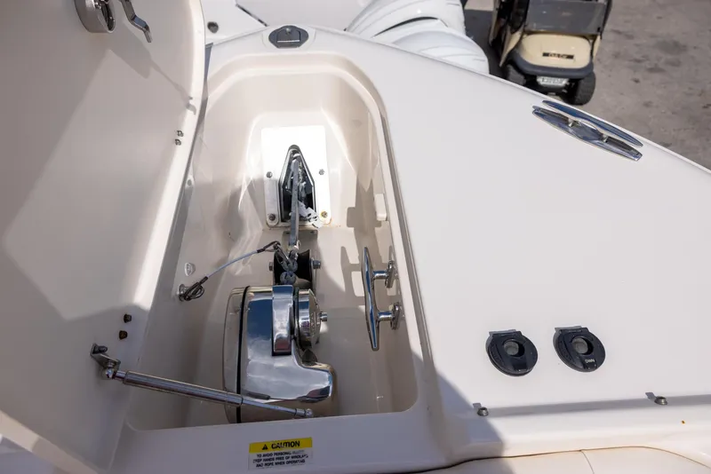 Slide: The Image of 2018 Grady-White Freedom 335 boat anchor compartment with winch and controls. - 21