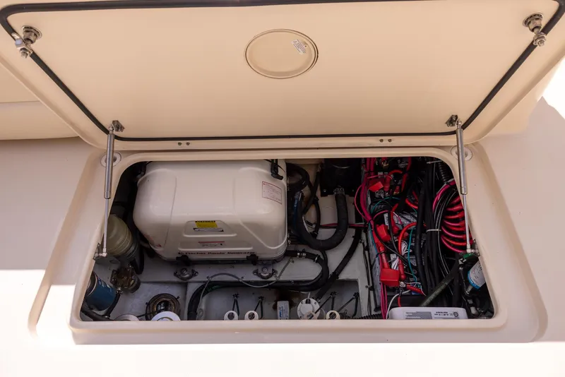 Slide: The Image of 2018 Grady-White Freedom 335 boat compartment with wiring and equipment. - 23