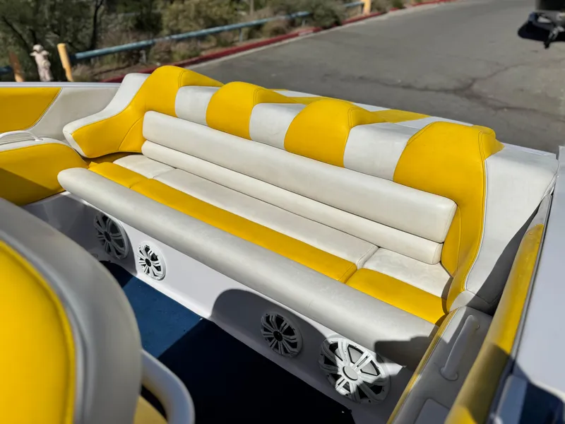 Slide: The Image of 2004 Donzi 38 ZX boat interior with yellow and white seating. - 11