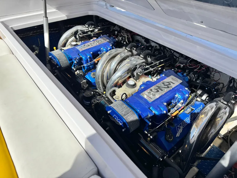 Slide: The Image of 2004 Donzi 38 ZX boat engine compartment with twin Mercury engines. - 15