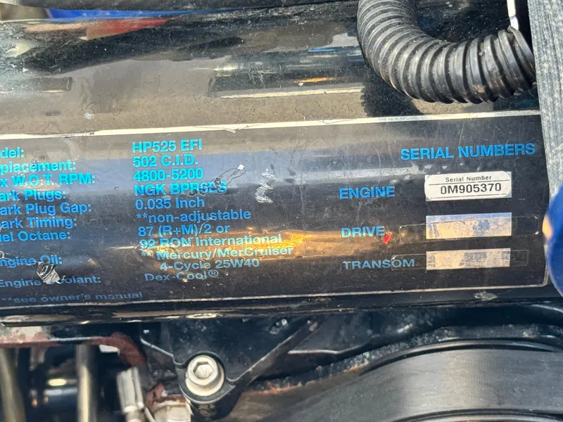 Slide: The Image of 2004 Donzi 38 ZX engine specifications and serial number details on a black surface. - 16