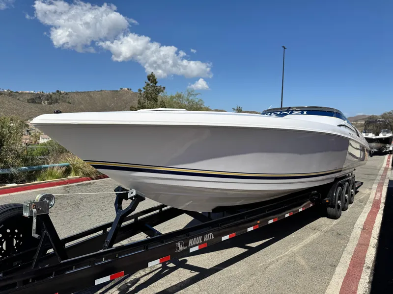 Slide: The Image of 2004 Donzi 38 ZX powerboat on trailer under clear blue sky. - 3