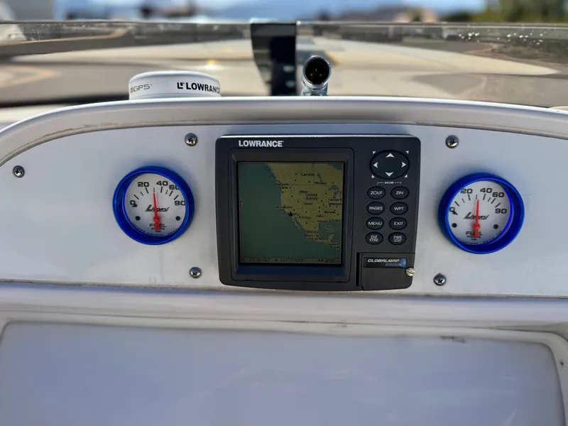 Slide: The Image of Dashboard of a 2004 Donzi 38 ZX boat featuring a Lowrance GPS system. - 32