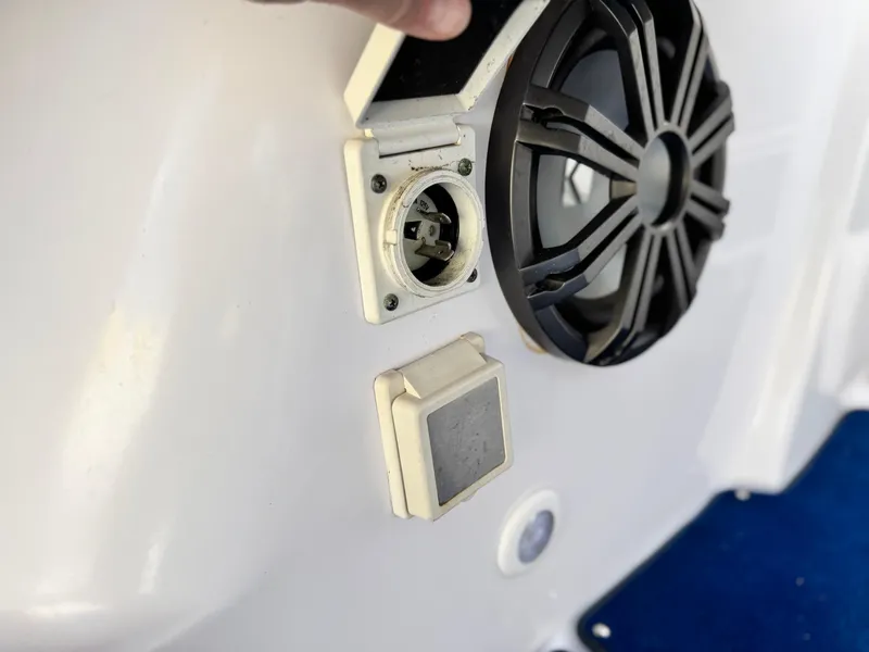 Slide: The Image of 2004 Donzi 38 ZX boat speaker and electrical outlet on white surface. - 38