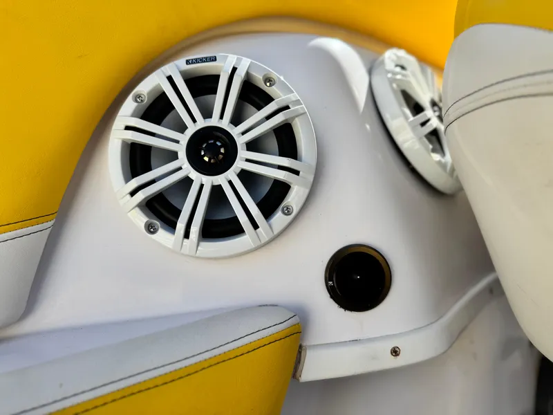 Slide: The Image of 2004 Donzi 38 ZX boat interior with yellow upholstery and marine speakers. - 39